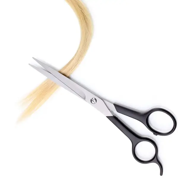 Professional scissors cutting through a lock of blonde hair, illustrating the hair sample collection process for drug and alcohol testing
