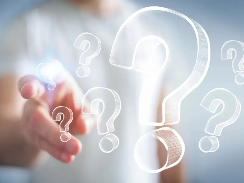 Person interacting with floating question marks, representing common inquiries about hair drug and alcohol testing services