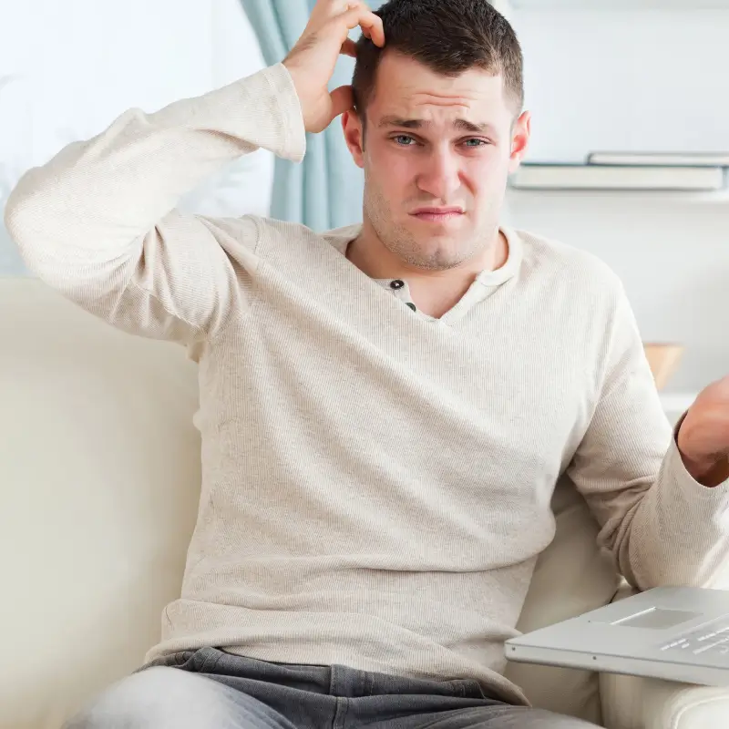 Man scratching his dead cofused about his Methylamphetamine & Amphetamine drug Results in Hair Drug Testing
